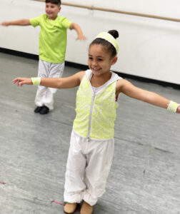 Two Musical Theatre Dance students practice during a dance class for kids.