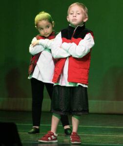 Two young HipHop dancers on stage during a performance.